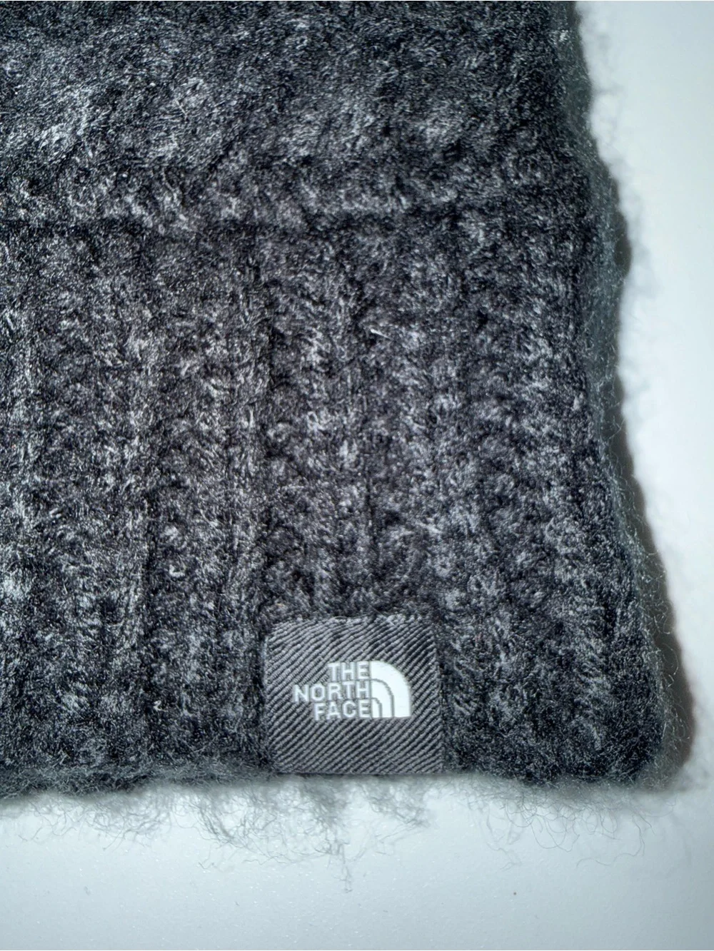 The North Face Black Knit Pom Beanie with Gray Faux Fur Pom
